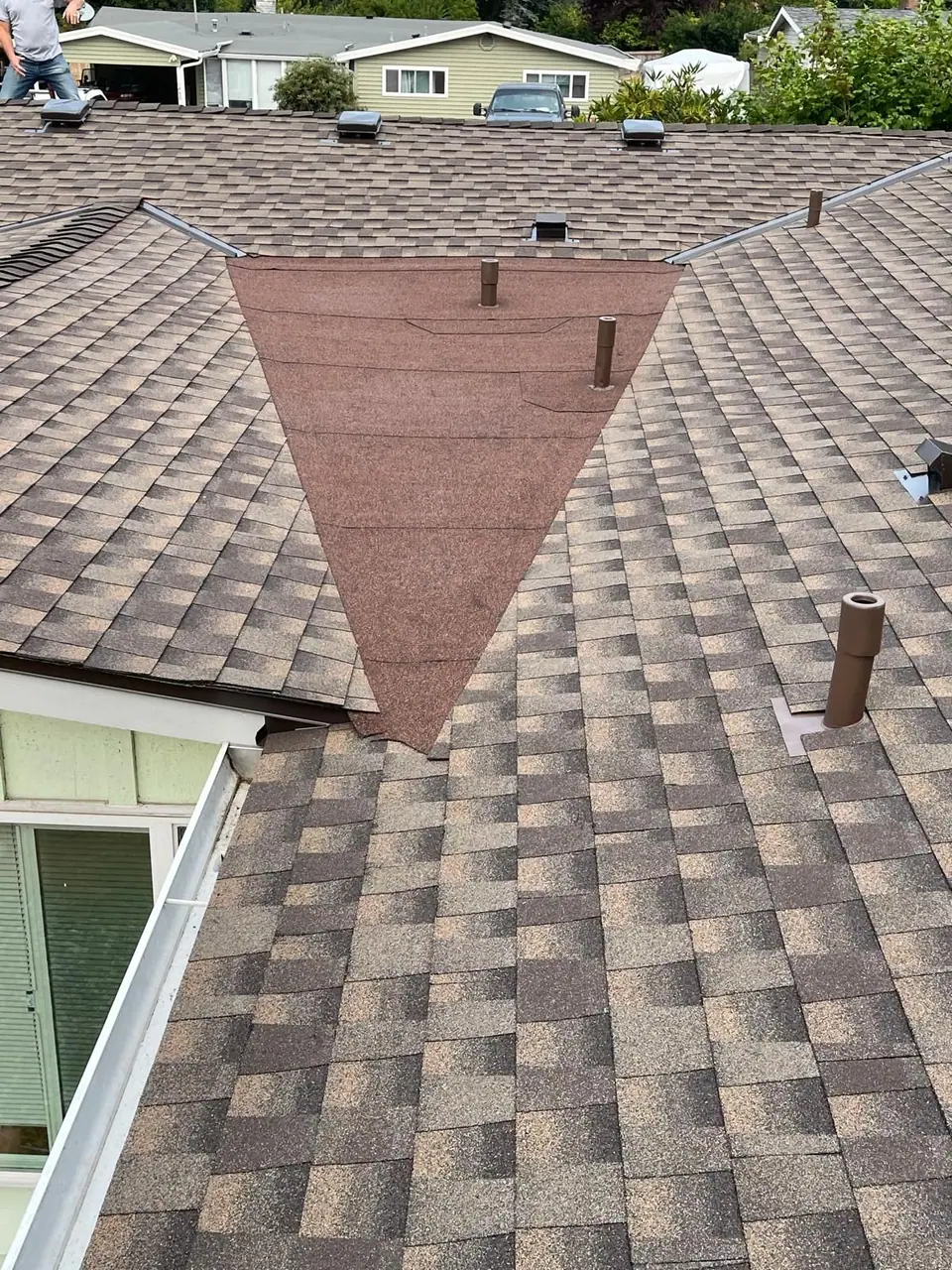 Brown architectural shingles around the vents