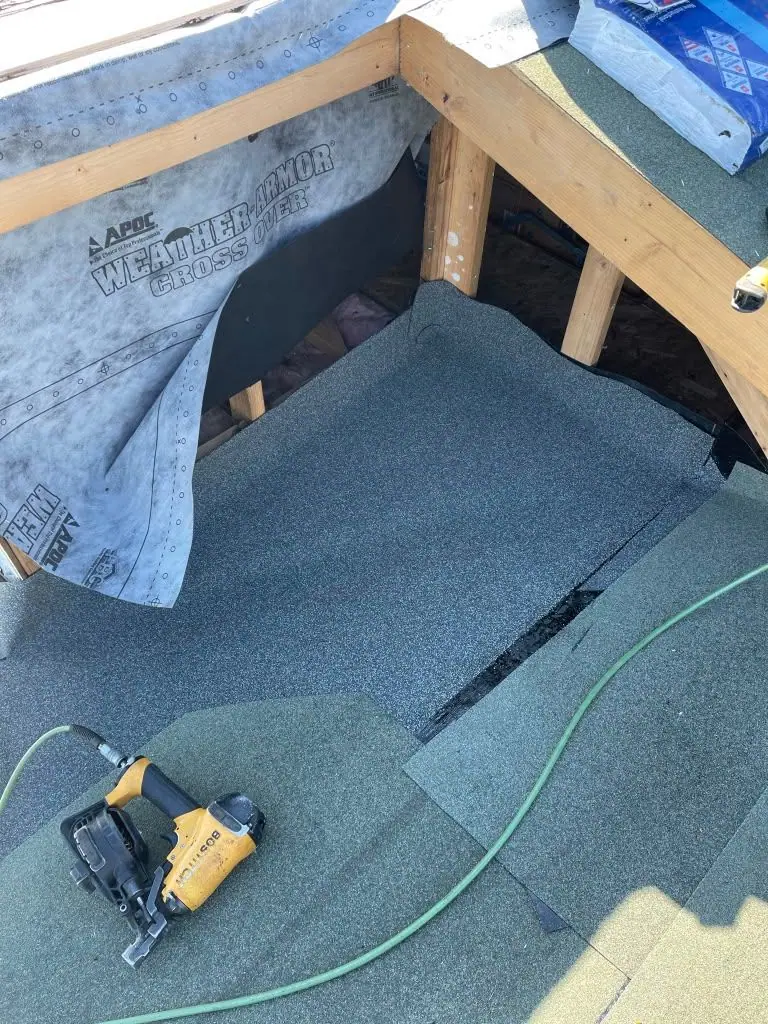 First courses of shingles at a new wall