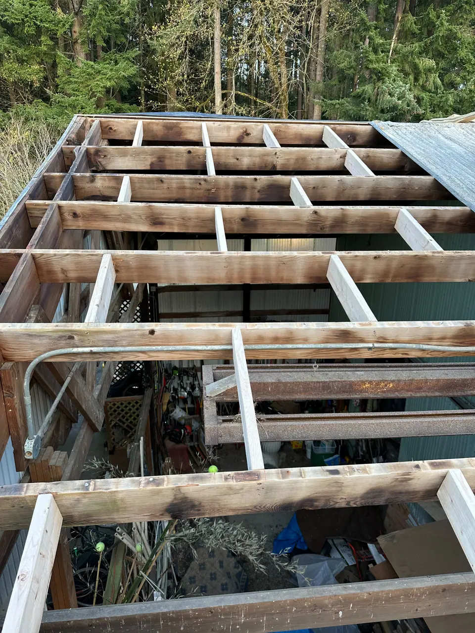 Rafters exposed where the old deck failed