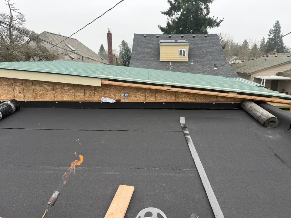 Flat roof on a garage and porch
