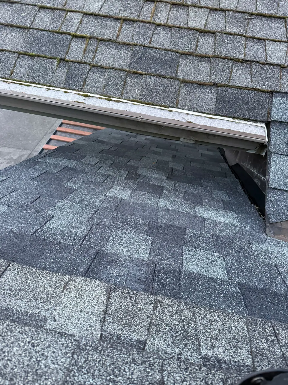 Shingle detail under a dormer