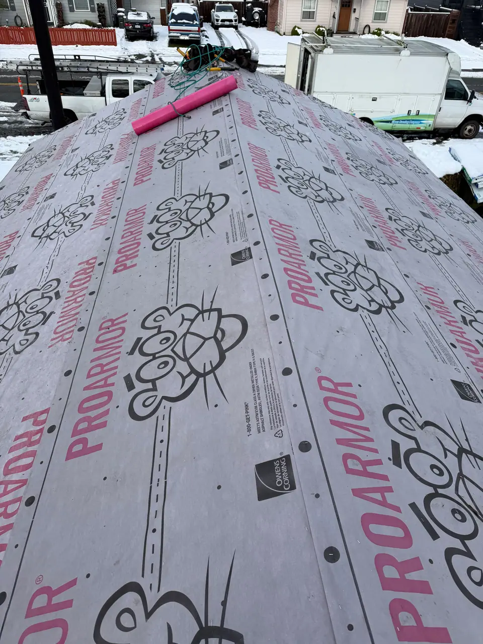 Synthetic underlayment rolled out on the deck