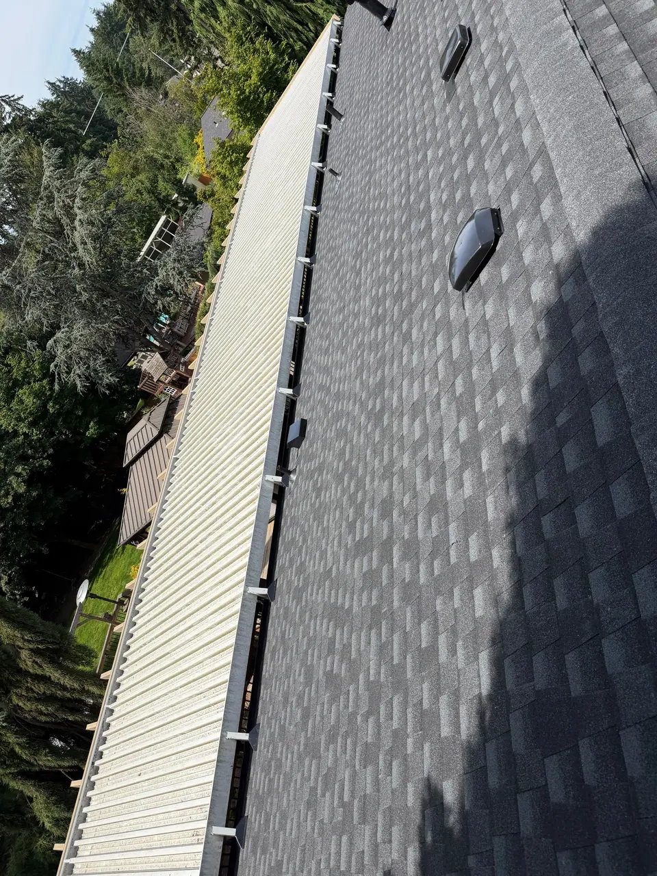 Shingles along a sided wall