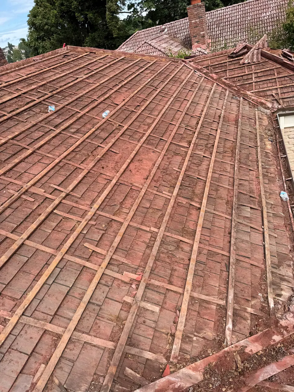 Old tile roof being stripped