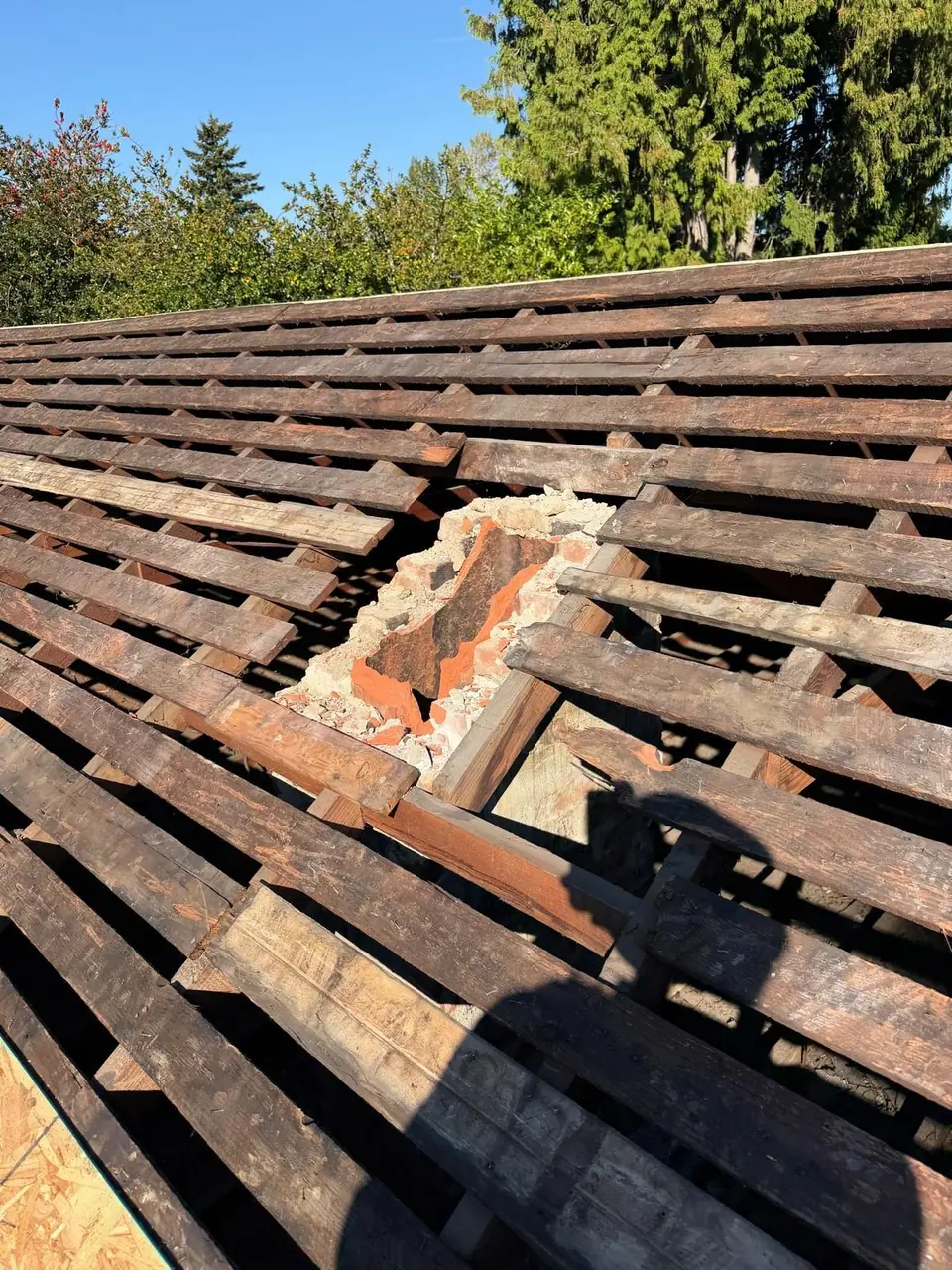 Gapped boards under the old roof