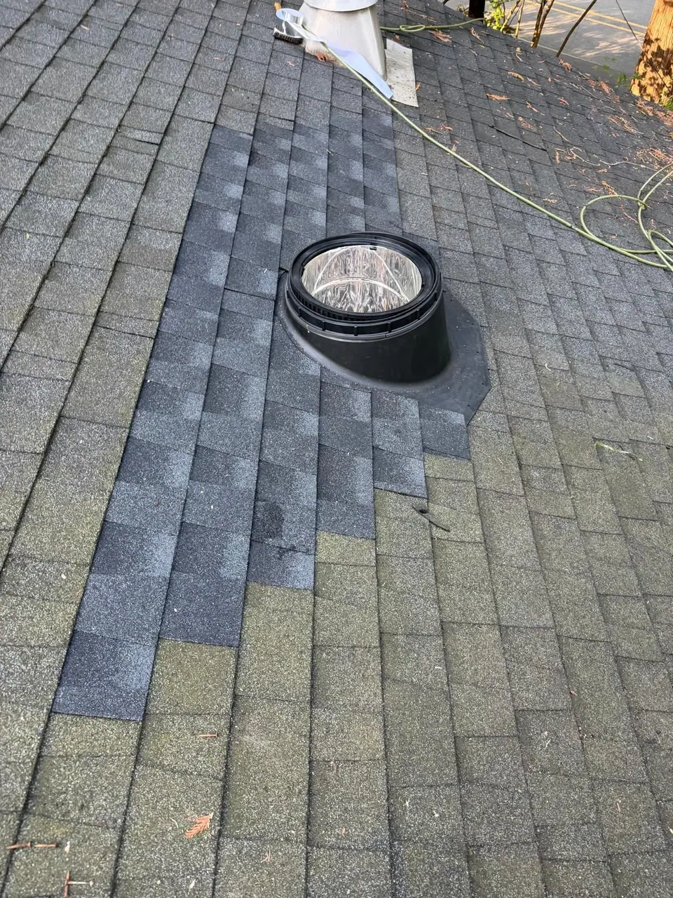 New skylight, shingles woven around it